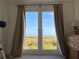 A room with a window and a view at Arfryn in Bull Bay