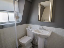 A bathroom with a toilet and sink at FLAT 3 54a broad Street (2 bed sleeping 4) Lyme Regis