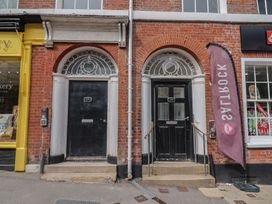 Two doors with steps and signage at Flat 3 54a Broad Street in Lyme Regis