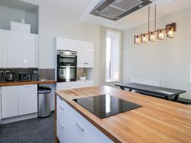 A kitchen with cabinets and appliances at Rocklands in Shap