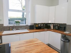 A kitchen with a sink and appliances at Rocklands in Shap