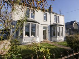 A house with large windows and a garden at Rocklands in Shap