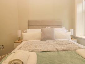 A bedroom with a bed and pillows at Rocklands in Shap