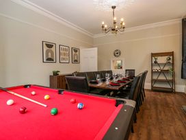 A dining room with a pool table and dining table at Rocklands in Shap