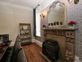 A dining room with a table and chairs at Rocklands in Shap