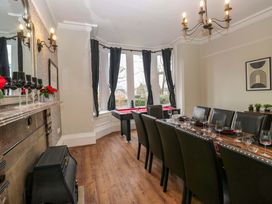 A dining room with a large table and chairs at Rocklands in Shap
