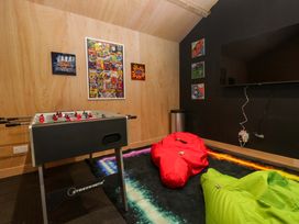 A game room with foosball table and bean bags at Rocklands in Shap