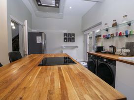 A kitchen with an island and appliances at Rocklands in Shap