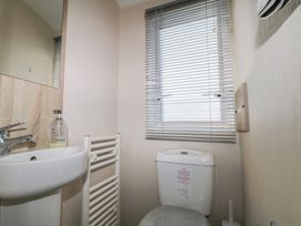 A bathroom with a sink and toilet at Tower View Number 34 Pevensey