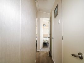 A hallway leading to a bedroom at Tower View Number 34 in Pevensey Bay
