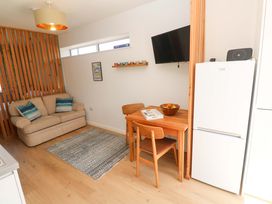A dining area with a table and chairs at Carn Brea in Redruth