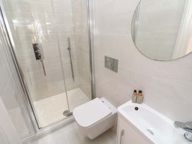 A bathroom with a shower and toilet at Carn Brea in Redruth