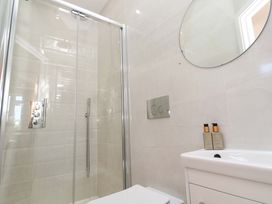 A bathroom with shower, toilet, and sink at Carn Brea in Redruth