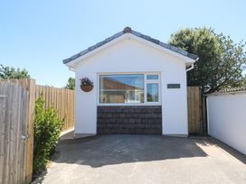 A house with a front entrance and wooden fence at Carn Brea in Redruth