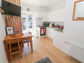 A kitchen with table and chairs at Carn Brea in Redruth