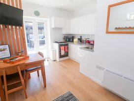 A kitchen with cabinets and appliances at Carn Brea in Redruth