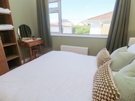 A bedroom with a bed and a table at Carn Brea in Redruth