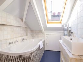 A bathroom featuring a bathtub and sink at 3 The Old Cornstore 