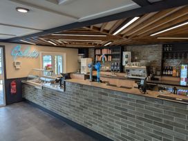 A service counter with a gelato display and coffee machine at Nature's Nook - Billing Aquadrome