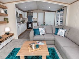 A living room with a sofa and coffee table at Aquadrome Abode 3bed - Billing Aquadrome