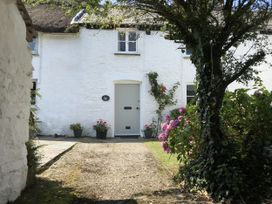 A building with a door and plants at Trevean in Crackington Haven