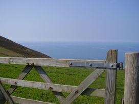 A wooden gate overlooking the sea at Trevean in Crackington Haven