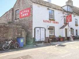 A pub with bicycles parked outside at Mallow Cottage Langton Matravers
