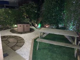 A garden with a storage box and table at The Shipwrights in Whitby