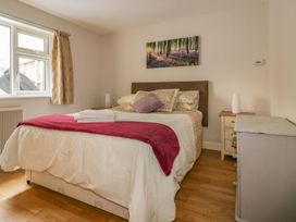 A bedroom with a bed and bedside table at Chy Vean in St. Agnes