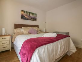 A bedroom with a bed and bedside table at Chy Vean St. Agnes