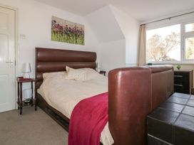 A bedroom featuring a bed and window at Chy Vean in St. Agnes