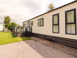 A mobile home with garden area at 22 Yealand in Carnforth