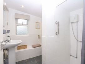 A bathroom with a sink and shower at Hafan Bach Bwlchtocyn near Abersoch