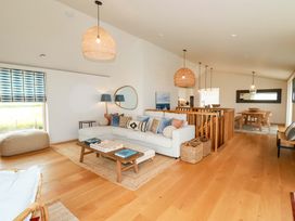 A living room with a sofa and coffee table at 8 Karn Havos in St. Eval near Mawgan Porth