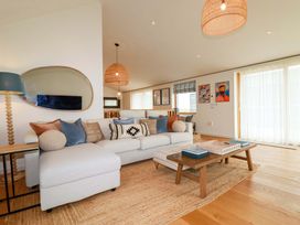 A living room with a sofa and coffee table at 8 Karn Havos St. Eval near Mawgan Porth