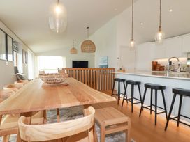 A dining room with a table and chairs at 8 Karn Havos St. Eval near Mawgan Porth