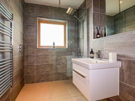 A bathroom with a shower and sink at 8 Karn Havos St. Eval near Mawgan Porth