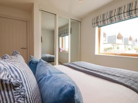 A bedroom with a bed and pillows at 8 Karn Havos St. Eval near Mawgan Porth