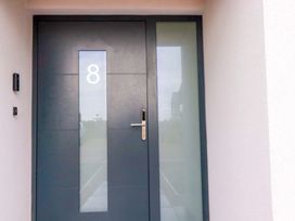 A door with number 8 at 8 Karn Havos St. Eval near Mawgan Porth