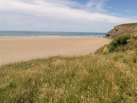 A beach with sand and ocean view at 8 Karn Havos St. Eval near Mawgan Porth