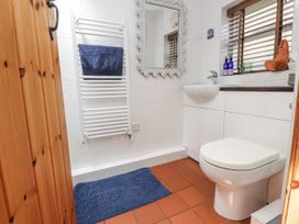 A bathroom with a wash basin and toilet at Copper Miners Cottage, Beddgelert, Eryri (snowdonia)