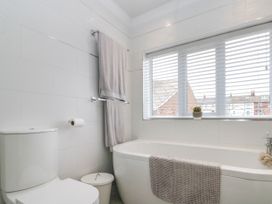 A bathroom featuring a bathtub and toilet at No.64 Nelson St in Bridlington