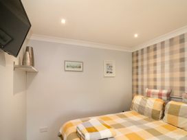 A bedroom with a bed and TV at No.64 Nelson St in Bridlington
