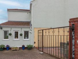 An outdoor area with a gate and windows at No.64 Nelson St, Bridlington