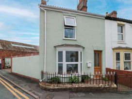 A house with a fence and plants at No.64 Nelson St in Bridlington