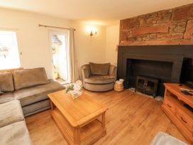 A living room with a sofa and coffee table at Sun House in Allonby