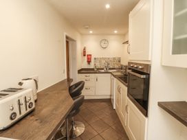 A kitchen with appliances and countertops at Sun House in Allonby
