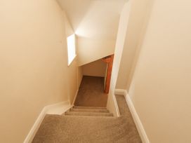 A staircase with a window at Sun House in Allonby