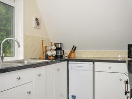 A kitchen with a sink and dishwasher at Valley Lodge 2 Callington