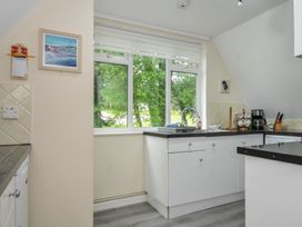 A kitchen with a window and sink at Valley Lodge 2 Callington